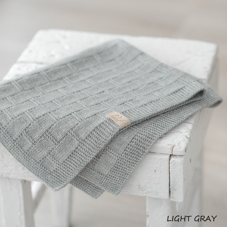 Grey knitted baby blanket deals