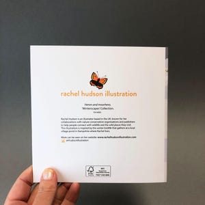 May include: A square card featuring the text "rachel hudson illustration" in orange. A butterfly illustration is above the text. The card also includes text about the artist and her work, and a website address.