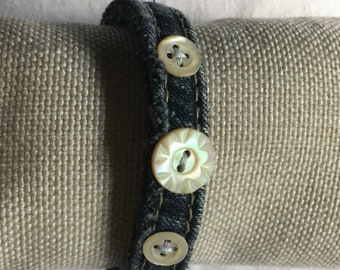 Recycled denim jeans bracelet in navy blue and antique mother of pearl buttons. For women.