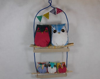 5 small owls in perched fabrics. Decorative mobile.