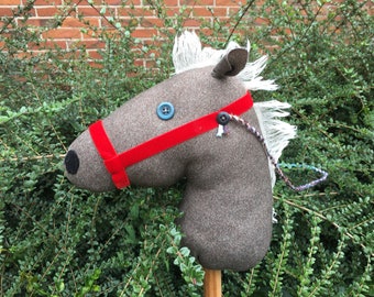 Horse stick in khaki brown fabric, toy for child.