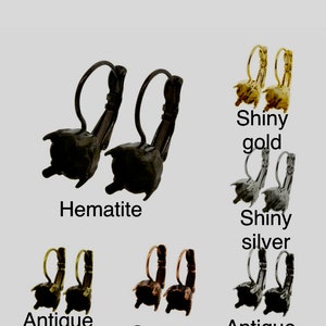 May include: Five pairs of earrings in different finishes: hematite, shiny gold, shiny silver, antique gold, and copper. Each pair features a small, round, textured design.