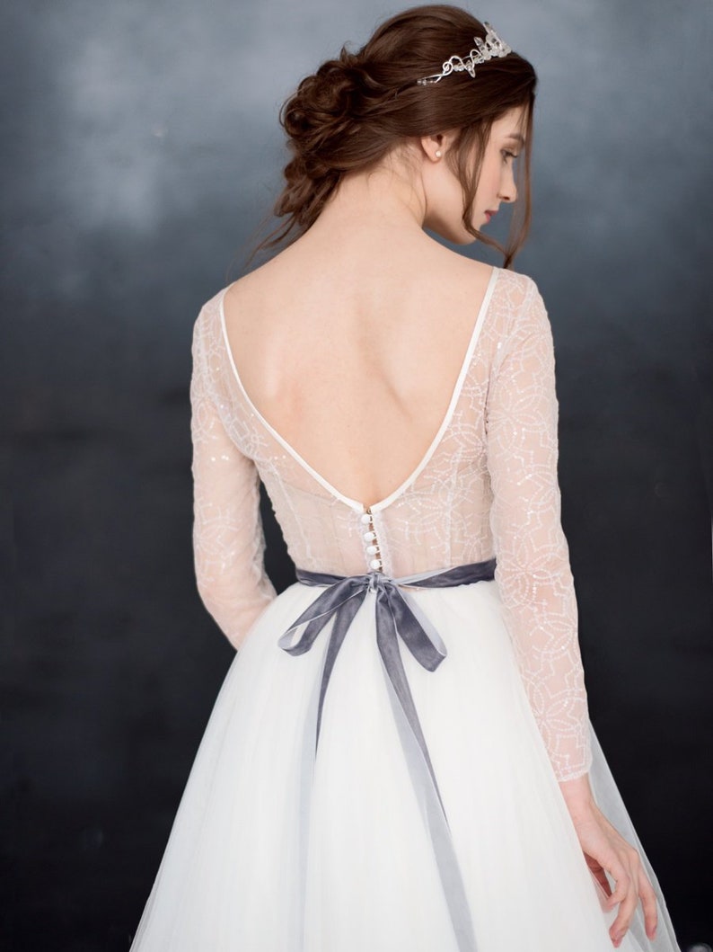 simple white wedding dress with grey belt