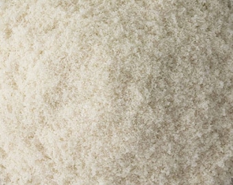 May include: Close-up of a bowl of fine white granulated sugar.