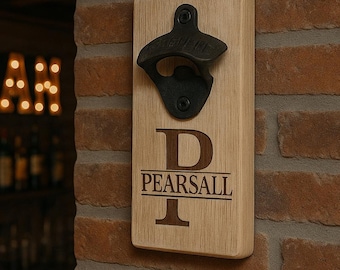 May include: A wooden bottle opener with a black metal opener and the letter "P" engraved on the front. The name "PEARSALL" is engraved below the letter.