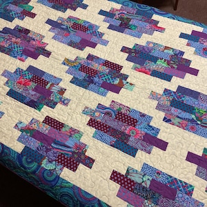 Handmade bright quilt with Kaffe Fassett fabrics