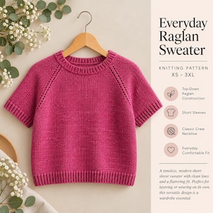 May include: A magenta short-sleeve sweater with a crew neckline and raglan sleeves, displayed on a wooden hanger. The text reads Everyday Raglan Sweater, Knitting Pattern XS-3XL, Top-Down Raglan Construction, Short Sleeves, Classic Crew Neckline, Everyday Comfortable Fit.