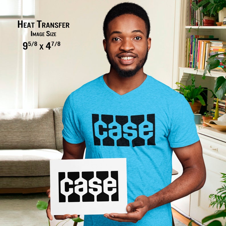 May include: A light blue V-neck t-shirt with the word "case" in a black, geometric font. The image also shows a white print with the same design. The image size is 9 5/8 x 4 7/8 inches.