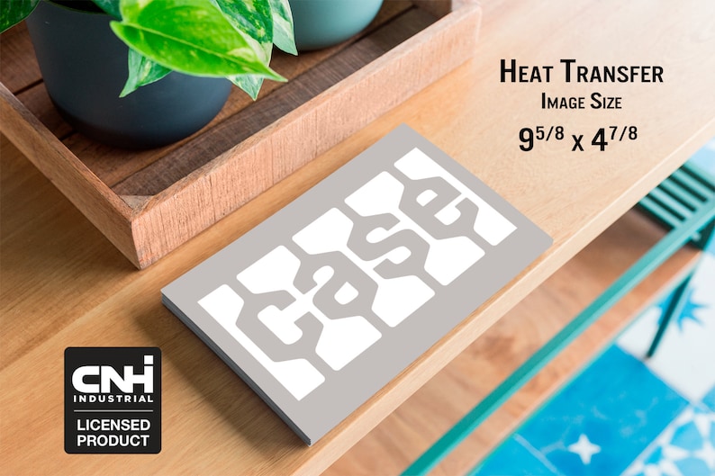 May include: A gray heat transfer with the word "CASE" in a white, stylized font. The image size is 9 5/8 x 4 7/8 inches. The CNH Industrial licensed product logo is in the lower left corner. The transfer is on a wooden surface.
