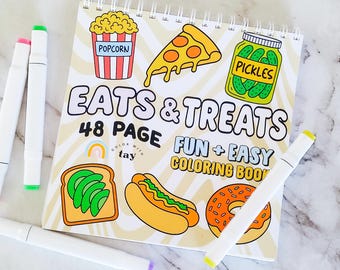 Libro da colorare con rilegatura a spirale "Eats & Treats": 48 pagine di divertenti immagini di cibo e snack. Carta resistente alle sbavature. Pennarelli a base alcolica.