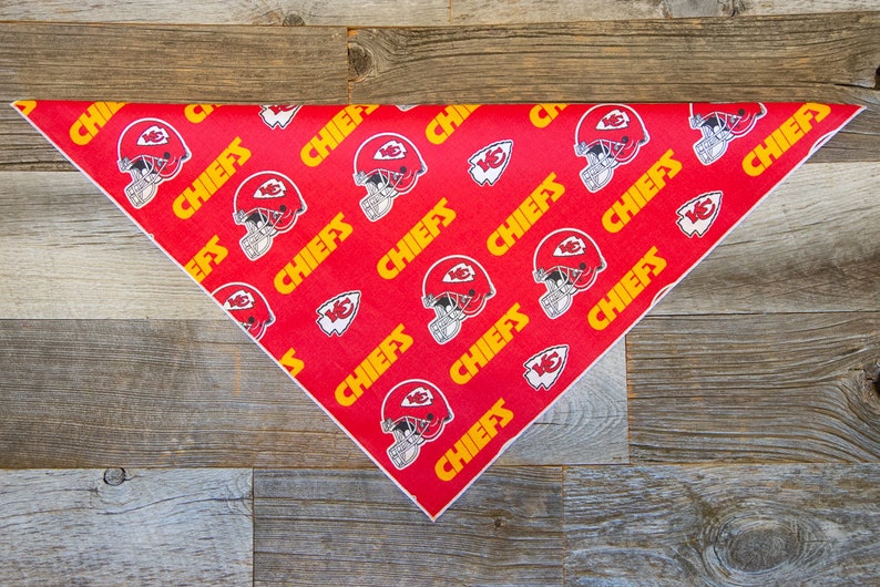 May include: Red triangular bandana with a white border and a repeating pattern of yellow "CHIEFS" text and a football helmet graphic.