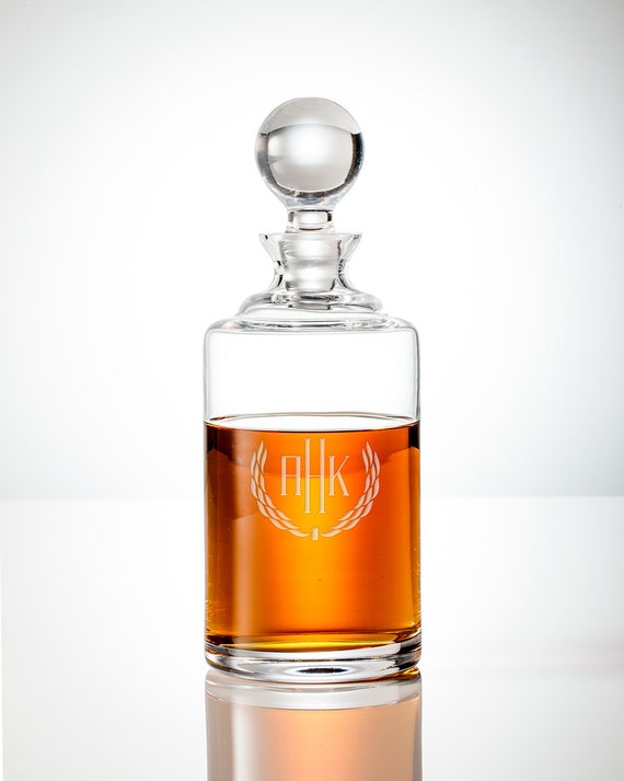 A hand-engraved crystal bourbon decanter with monogram — timeless, weighty, and 124 favorites prove people actually buy it as a gift.