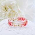 Resin Ring with Pressed Pink, Red, White Queen Anne's Lace Flowers and Gold Flakes, Pink Queen Anne Ring, White Queen Anne's Lace Flowers product logo