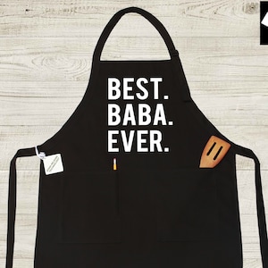 May include: Black kitchen apron with two pockets and a white print that says "BEST. BABA. EVER."