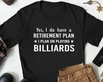 May include: Black t-shirt with white text that reads "Yes, I do have a RETIREMENT PLAN ★I PLAN ON PLAYING★ BILLIARDS".