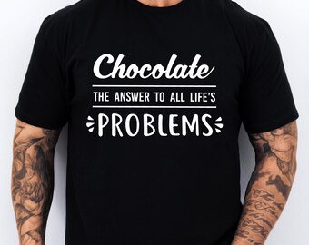 May include: Black t-shirt with white text that reads "Chocolate The Answer To All Life's Problems"