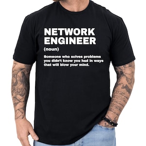 May include: Black t-shirt with the text "NETWORK ENGINEER (noun) Someone who solves problems you didn't know you had in ways that will blow your mind." The text is in white, and the shirt is plain.