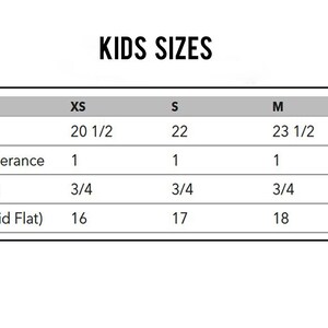 May include: A chart showing kids' clothing sizes in XS, S, M, and L. The chart lists body length, body length tolerance, chest tolerance, and chest width (laid flat) in inches.