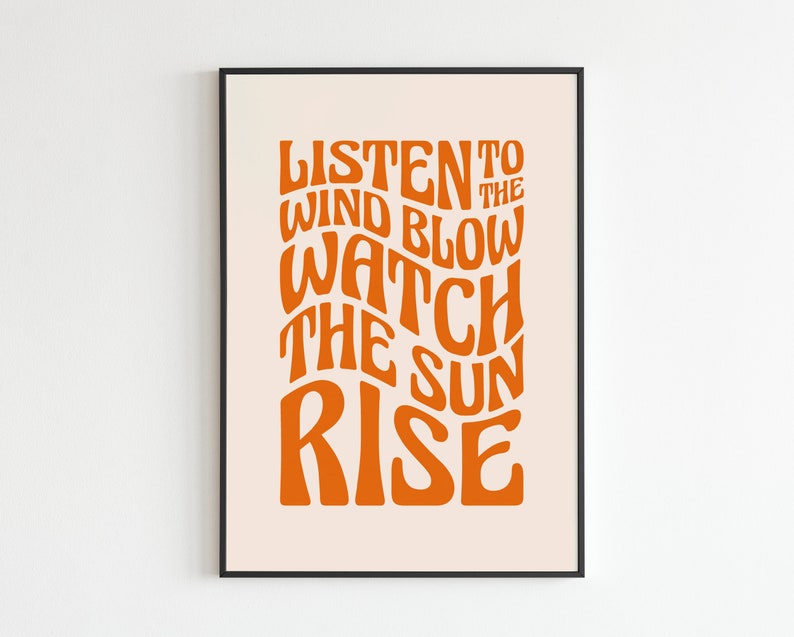May include: Orange text on a light peach background in a black frame reads "Listen to the wind blow watch the sun rise".