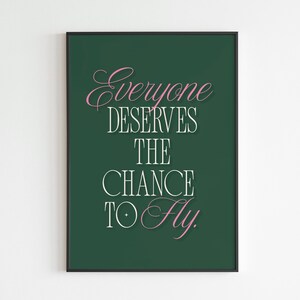 May include: A green poster with white text that reads "Everyone deserves the chance to fly." The words "Everyone" and "fly" are in pink.