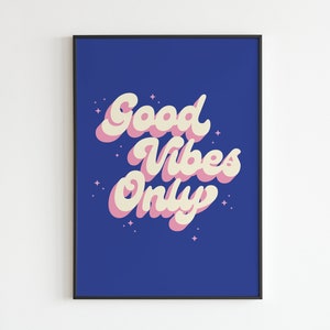 May include: A blue background with the text "Good Vibes Only" in pink and white lettering. The text is in a retro font style.
