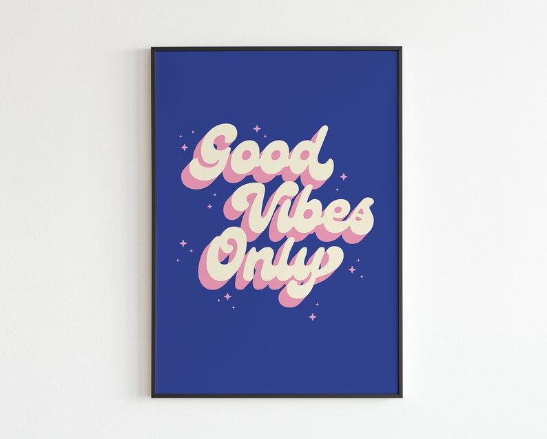 May include: A blue background with the text "Good Vibes Only" in pink and white lettering. The text is in a retro font style.