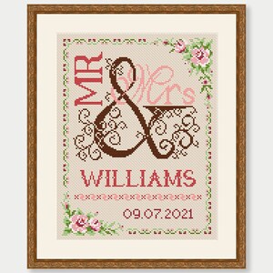 May include: Cross-stitch embroidery design featuring the words "Mr & Mrs Williams" with a decorative ampersand and floral accents. The date "09.07.2021" is also included.