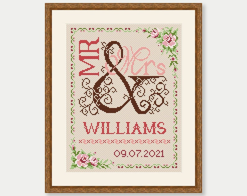 May include: Cross-stitch embroidery design featuring the words "Mr & Mrs Williams" with a decorative ampersand and floral accents. The date "09.07.2021" is also included.
