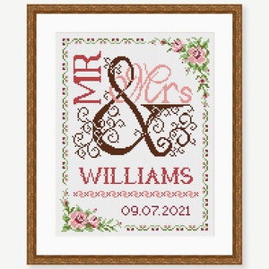 May include: Cross-stitch pattern with a floral border, featuring the words "Mr. & Mrs. Williams" and the date "09.07.2021".