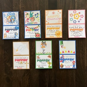 May include: Ten colourful thank you cards with cartoon characters and the text "Hope you had a poppin' time at my party!"  Each card has a different character and the name of the friend who hosted the party.