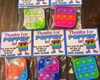 May include: Six colorful pop-it fidget toys packaged in clear plastic bags with a thank you note that says "Thanks for Poppin' in! See you on the 1st day of school! Mrs. Baker".
