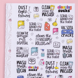 May include: A sheet of colorful stickers with illustrations and text related to cleaning tasks. The stickers feature phrases like "Clean the Vacuum Rollers", "Scrub Around the Toilet", "Wash Trash Can", and "Dust Light Fixtures".