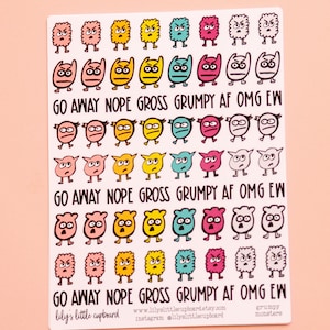 May include: A sheet of stickers featuring colorful cartoon monsters with different expressions. The stickers have phrases like "Go Away", "Nope", "Gross", "Grumpy AF", "OMG", and "Ew".