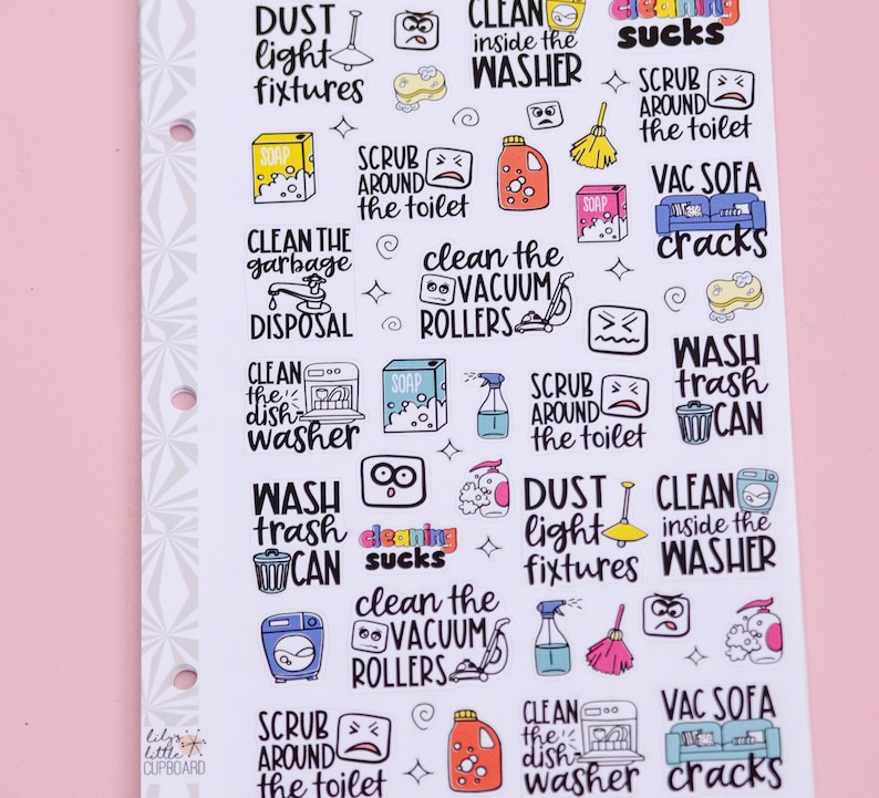May include: A sheet of colorful stickers with illustrations and text related to cleaning tasks. The stickers feature phrases like "Clean the Vacuum Rollers", "Dust Light Fixtures", "Wash Trash Can", and "Scrub Around the Toilet".
