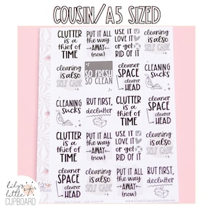 May include: A sheet of 12 printable stickers with motivational cleaning quotes. The stickers are white with black text and illustrations. The quotes include "Clutter is a thief of time", "Cleaning is also self care", "Put it all the way away", "But first, declutter", "Use it love it or get rid of it", "Cleaner space clearer head", "Cleaning sucks", "So fresh so clean".