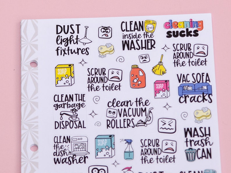 May include: A sheet of white stickers with colorful illustrations and text related to cleaning tasks. The stickers include phrases like "Clean the garbage disposal", "Clean the vacuum rollers", "Scrub around the toilet", "Wash trash can", and "Dust light fixtures".