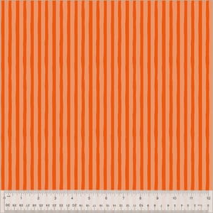 May include: Orange fabric with vertical stripes in varying shades of orange. The stripes have a hand-painted look. A ruler is at the bottom, showing measurements in inches.