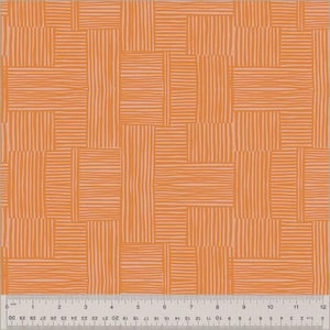 May include: Orange fabric with a geometric pattern. The design features rectangular blocks with vertical and horizontal lines, creating a woven texture. The background is a light peach color. A ruler is at the bottom of the image.