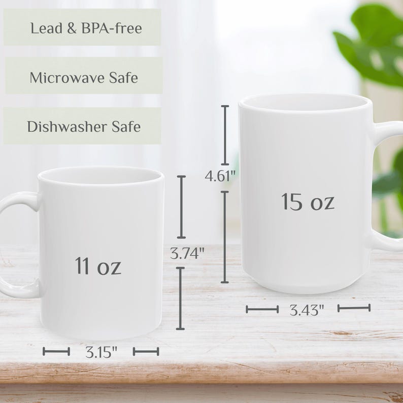 May include: Two white ceramic mugs, one 11 oz and the other 15 oz, are displayed. The 11 oz mug is 3.15" in diameter and 3.74" tall, while the 15 oz mug is 3.43" in diameter and 4.61" tall. Text indicates they are lead & BPA-free, microwave safe, and dishwasher safe.