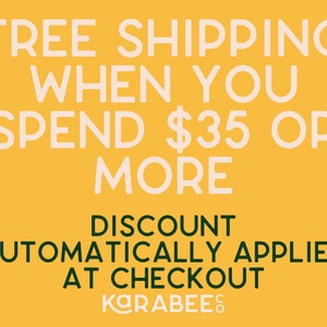 May include: Yellow background with white text that reads "FREE SHIPPING WHEN YOU SPEND $35 OR MORE DISCOUNT AUTOMATICALLY APPLIED AT CHECKOUT KARABEES".