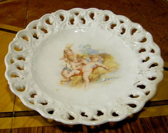 Antique China Ribbon Plate with Playful Cherubs Design