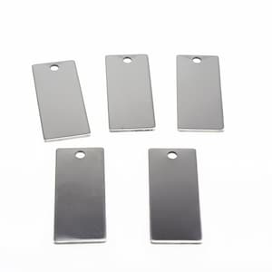 May include: Five silver rectangular metal tags with a hole at the top. The tags are blank and ready for personalization.