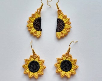 Puede incluir: Un par de pendientes de girasol. Los pendientes están hechos de metal dorado y tienen un diseño de girasol. Los girasoles están bordados con hilo amarillo y negro.