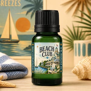 May include: A 15 ml green glass bottle of fragrance oil with a black cap. The label features the text "BEACH CLUB" and "SCENTSOFMAGIC.STORE" alongside an illustration of a coastal building, a sailboat, and a beach chair under a clear blue sky.