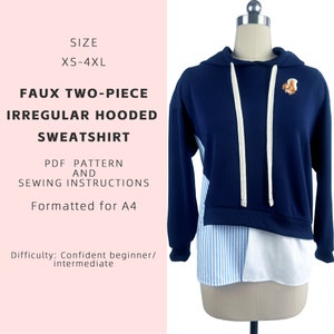 May include: A blue and white hooded sweatshirt with a striped pattern on the bottom. The sweatshirt is a two-piece design with a separate white and blue striped shirt underneath. The sweatshirt has a small squirrel applique on the front. The text "SIZE XS-4XL FAUX TWO-PIECE IRREGULAR HOODED SWEATSHIRT PDF PATTERN AND SEWING INSTRUCTIONS Formatted for A4 Difficulty: Confident beginner/intermediate" is printed on a pink background.