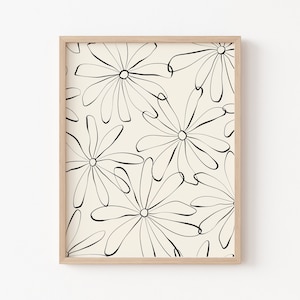 Puede incluir: Una impresi&oacute;n enmarcada con un dise&ntilde;o minimalista que presenta dibujos de l&iacute;neas negras de flores estilizadas sobre un fondo crema.