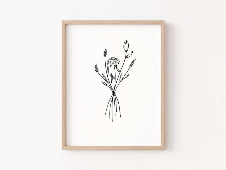 May include: A black and white line drawing of a bouquet of wildflowers in a simple frame. The flowers include a daisy, a tulip, and some grasses.