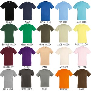 May include: A chart of 24 t-shirts in various colors, including white, black, navy, royal blue, sky blue, surf blue, aqua, emerald, bottle green, kelly green, army green, sage green, pale yellow, gold, red, burgundy, purple, sand, natural, pale pink, orchid pink, fuchsia, grey marl, dark grey, zinc, orange, earth, and chocolate.