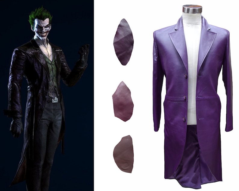 May include: A purple leather suit jacket with a single button closure. The jacket has a long, pointed collar and a single pocket on the left side. The jacket is on a mannequin.