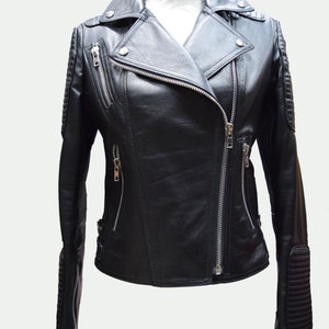 May include: A black leather motorcycle jacket with a zipper closure and silver hardware. The jacket has a stand-up collar and zippered pockets.